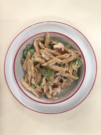 Whole wheat penne pasta with chicken and broccoli in cheese sauce