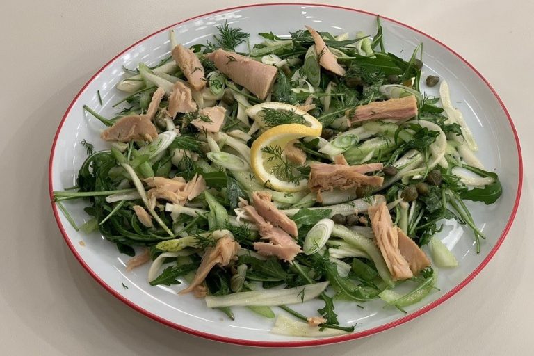 Salad with tuna, fennel, celery and dressing with olive oil and lemon